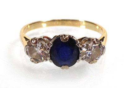 Lot A yellow metal ring set sapphire and two...