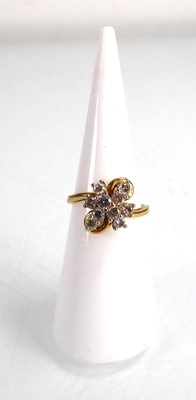 Lot An 18ct yellow gold cluster ring set ten small...