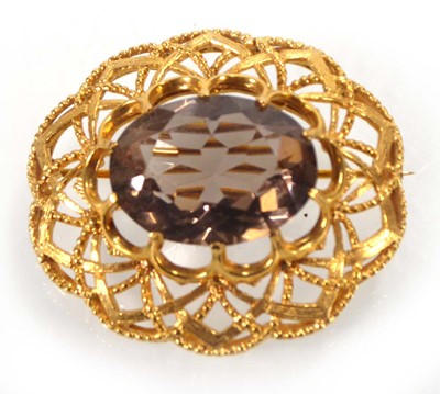 Lot A 9ct yellow gold openwork brooch set oval...