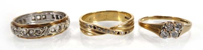 Lot A 9ct yellow gold ring set four small diamonds,...