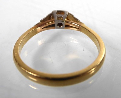 Lot A yellow metal ring set small diamond in an...