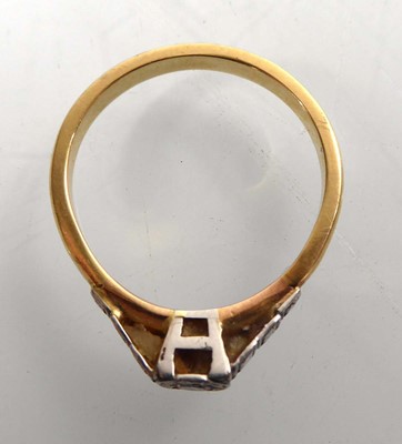 Lot A yellow metal ring set small diamond in an...