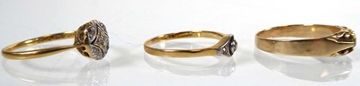 Lot An 18ct yellow gold ring set five small...