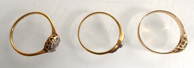 Lot An 18ct yellow gold ring set five small...