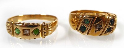 Lot An Edwardian 18ct yellow gold ring set four...