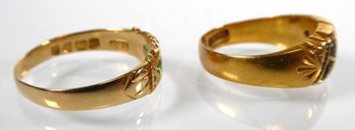 Lot An Edwardian 18ct yellow gold ring set four...