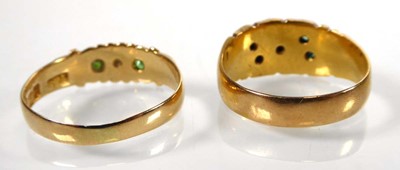 Lot An Edwardian 18ct yellow gold ring set four...