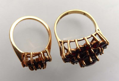 Lot Two 9ct yellow gold dress rings set garnet,...