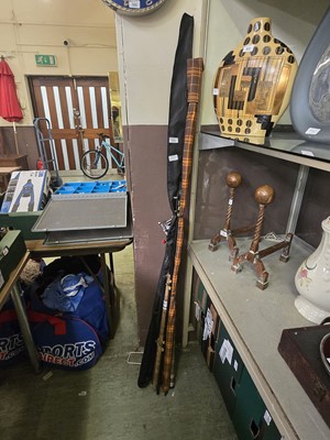 Lot 301 - An assortment of fishing rods along with a reel