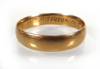 Lot A yellow metal wedding band, stamped 'K18',...