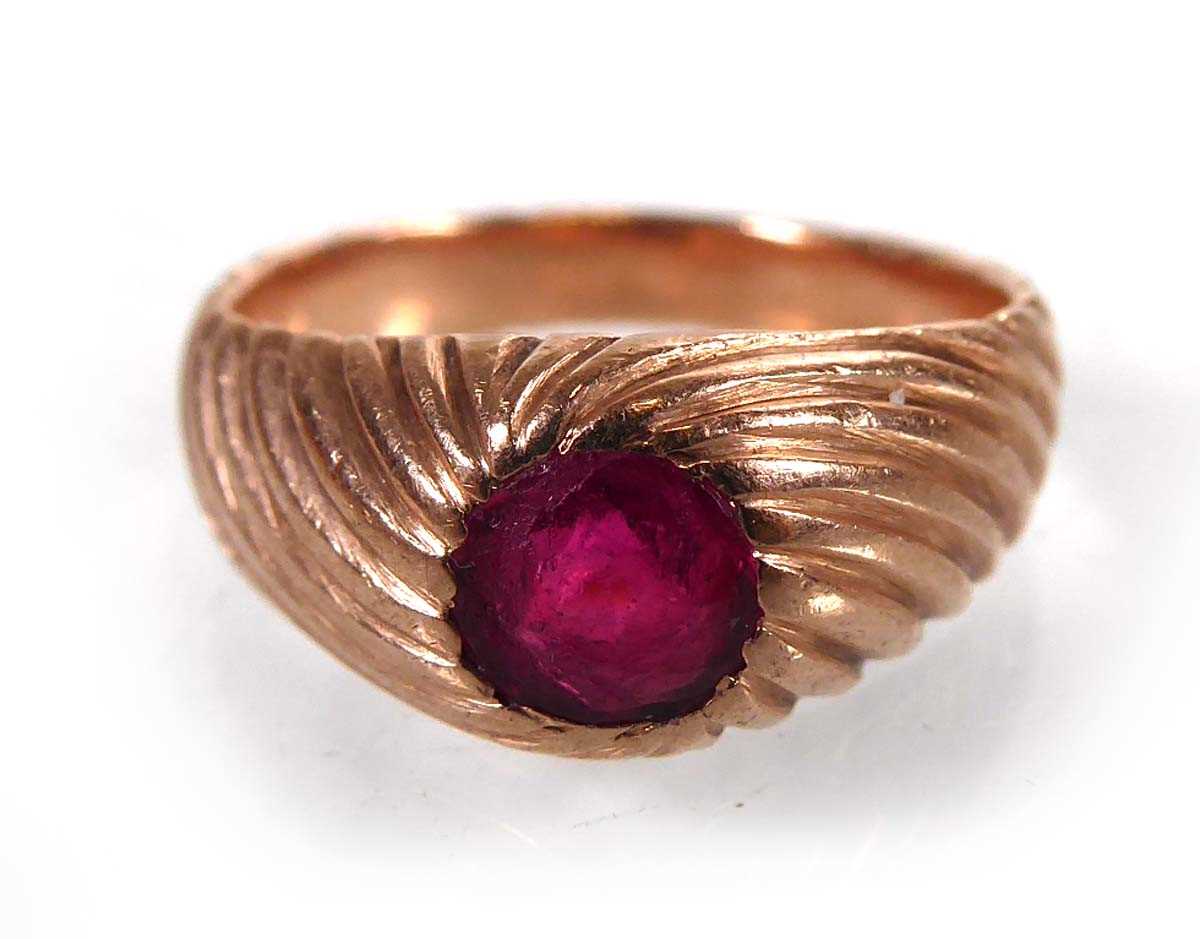 Lot A rose gold signet ring set red glass in a...