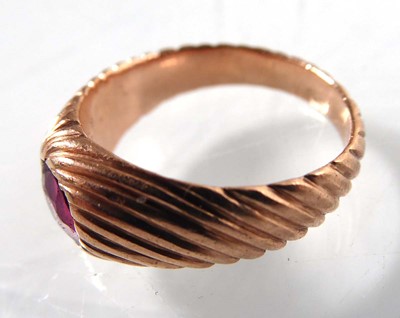 Lot A rose gold signet ring set red glass in a...