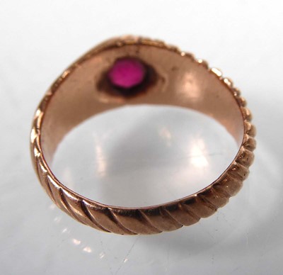 Lot A rose gold signet ring set red glass in a...