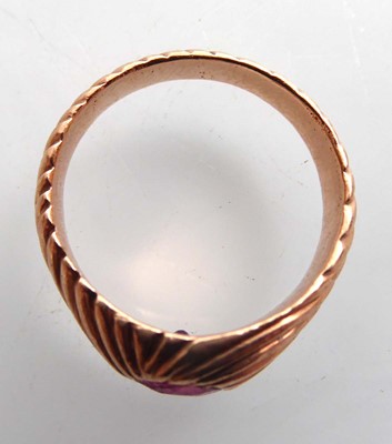 Lot A rose gold signet ring set red glass in a...