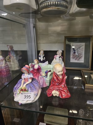 Lot 395 - Five Royal Doulton ceramic figurines 'Monica'...