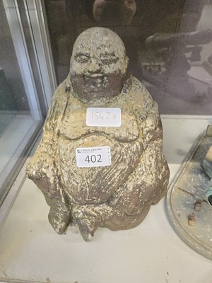 Lot 402 - A weathered stoneware garden figure of Buddha