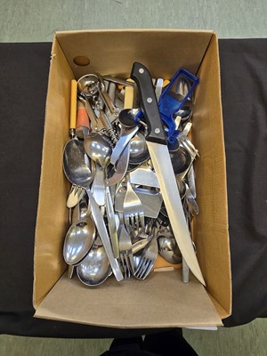 Lot 423 - A shoebox containing an assortment of flatware,...