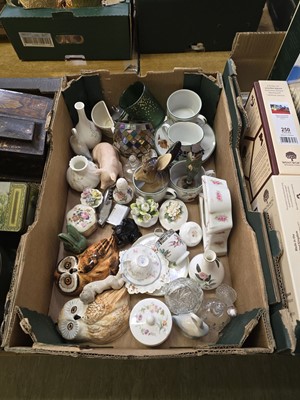 Lot 454 - A tray containing ceramic pigs, cups, saucers,...