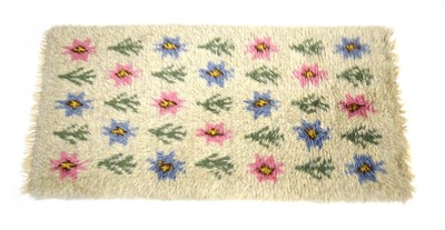 Lot 70 - A 1960's Swedish rya rug, the cream/white...