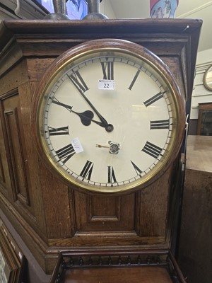 Lot 22 - A circular oak cased drop dial wall clock