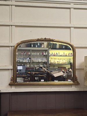 Lot 34 - A reproduction gilt over mantle mirror