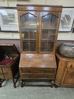 Lot 49 - An early 20th century oak bureau bookcase...