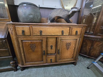 Lot 51 - An early 20th century oak sideboard having...