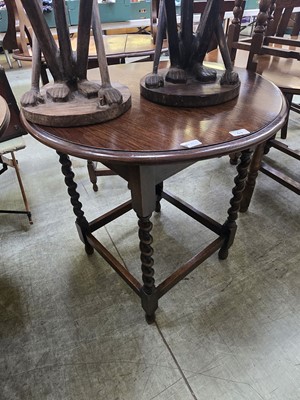 Lot 63 - An early 20th century circular topped oak...