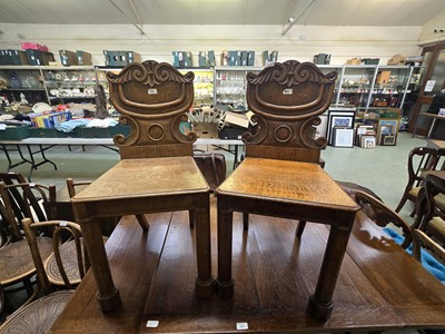 Lot 68 - A pair of Pugin style oak hall chairs