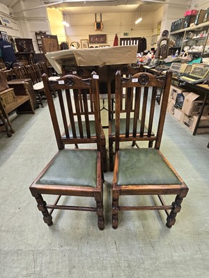 Lot 75 - A set of four early 20th century oak high back...