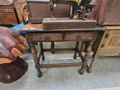 Lot 77 - A reproduction mid-20th century oak side table...