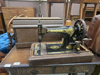 Lot 78 - An oak cased Singer manual sewing machine