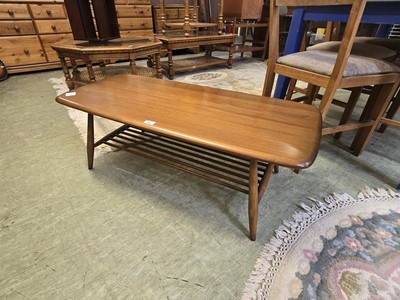 Lot 90 - A light Ercol coffee table with spindle under...