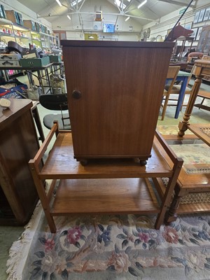 Lot 100 - A mid-20th century teak two tier tea trolley...