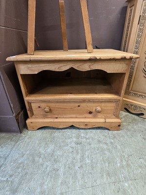 Lot 106 - A waxed pine unit having open storage above...