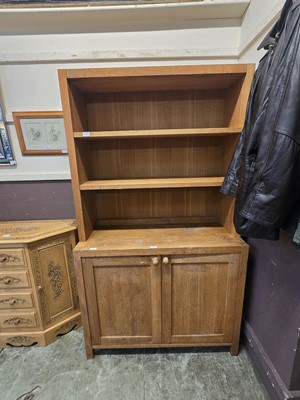 Lot 111 - An oak cabinet having bookshelf to top and...