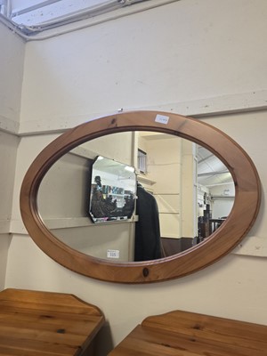 Lot 115 - A modern pine oval wall mirror