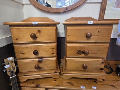 Lot 116 - A pair of modern pine bedside chests of three...