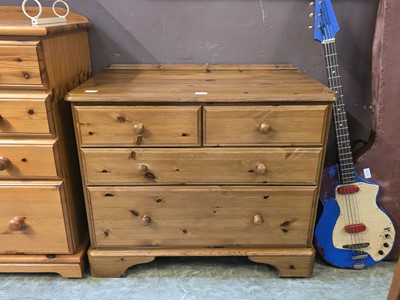 Lot 125 - A modern pine chest of two short over two long...