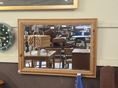 Lot 126 - A modern pine framed bevel glass wall mirror