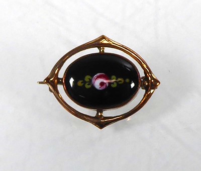 Lot A gilt metal Charles Horner brooch of oval...