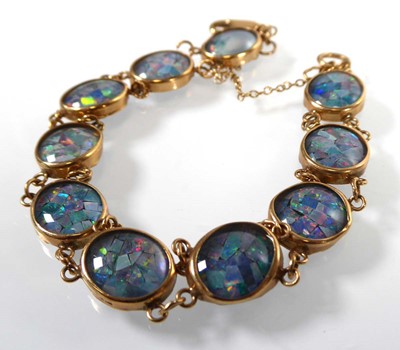 Lot A 9ct yellow gold bracelet having ten oval...