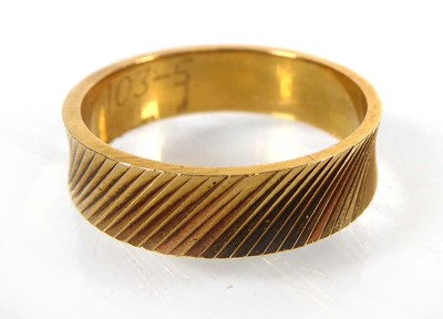 Lot An 18ct yellow gold diagonally engraved...