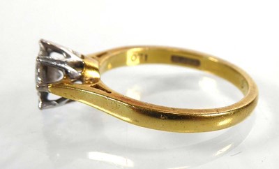 Lot An 18ct yellow gold ring set brilliant cut...