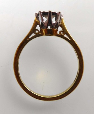 Lot An 18ct yellow gold ring set brilliant cut...