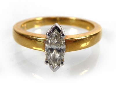 Lot An 18ct yellow gold ring set marquise cut...