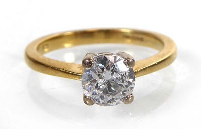 Lot An 18ct yellow gold ring set brilliant cut...