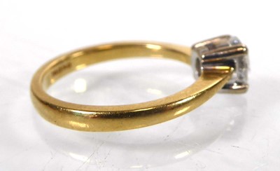 Lot An 18ct yellow gold ring set brilliant cut...