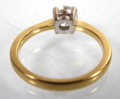 Lot An 18ct yellow gold ring set brilliant cut...