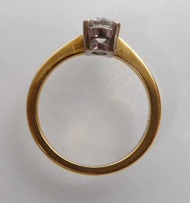 Lot An 18ct yellow gold ring set brilliant cut...